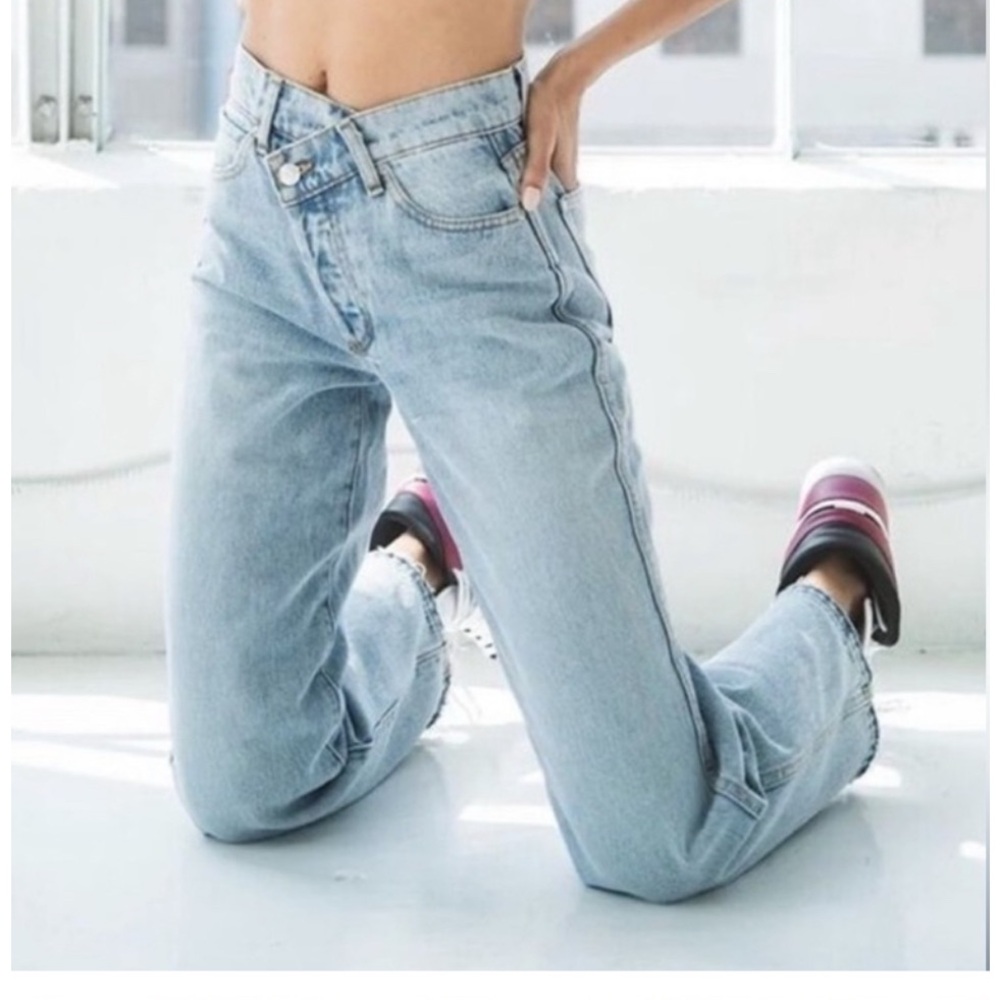 Revice size 25 crossover/asymmetrical waist denim jeans.‎ Button fly, acid wash.